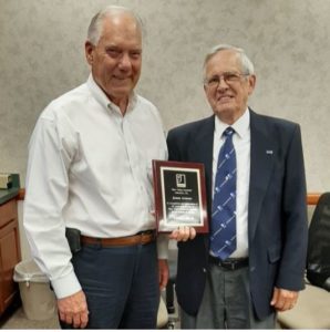 Joe Byrum presenting plaque for 25 years to James Armour