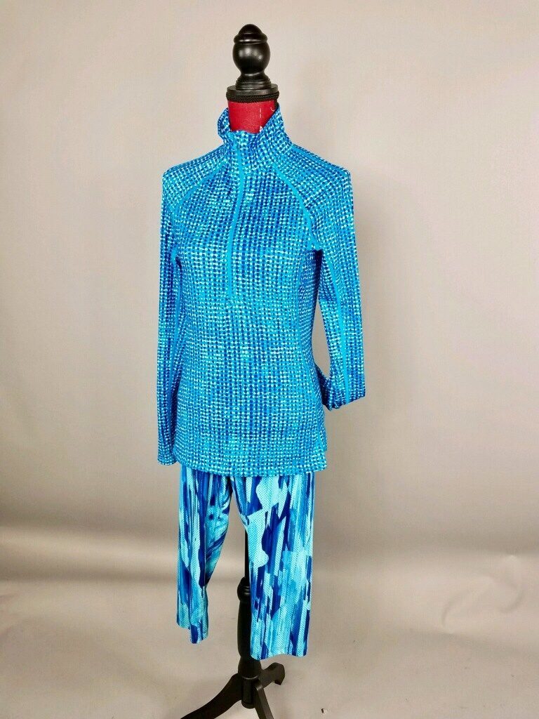 Mannequin dressed in blue athletic jacket and blue leggings